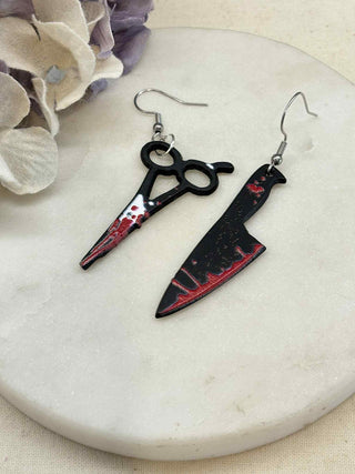 Cut to the bone earrings