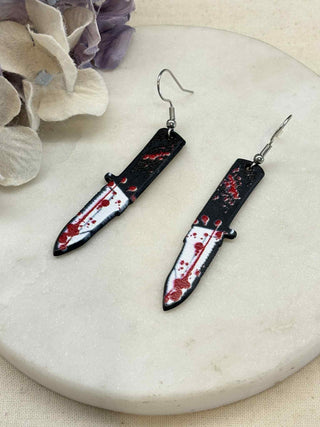 Cut to the bone earrings