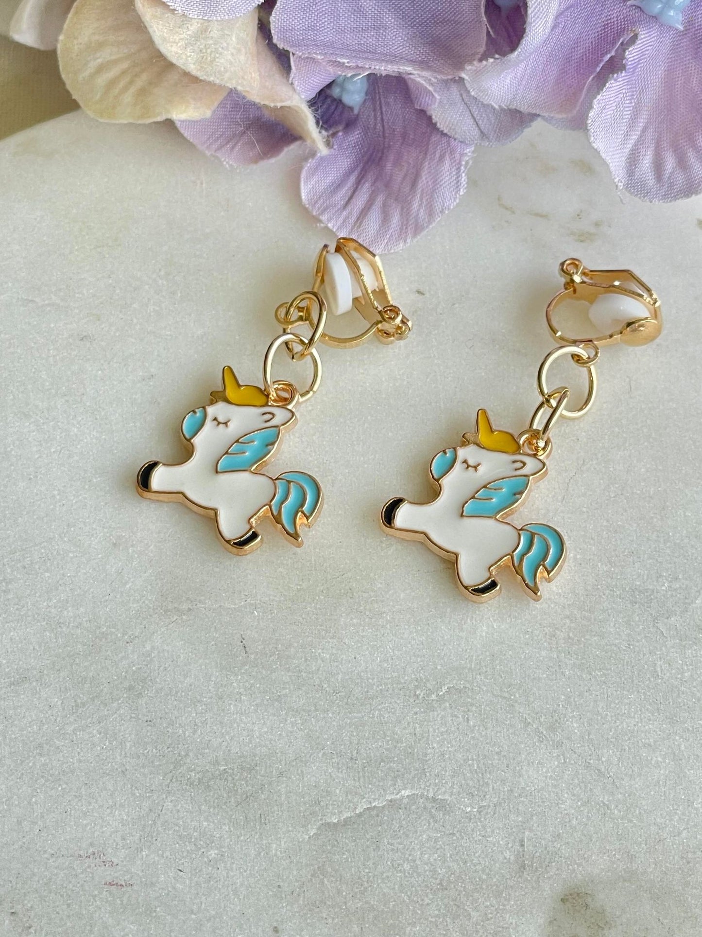 White and blue pony clip-on earrings