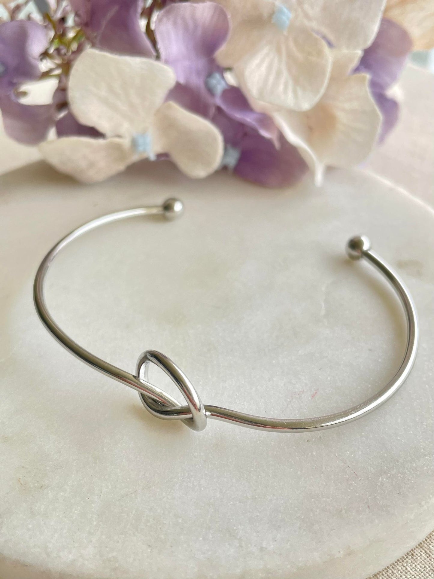 Knotted silver bangle