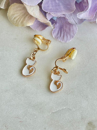 White cat clip-on earrings