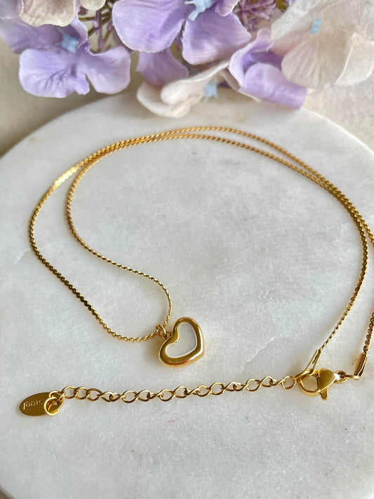 See inside my heart gold necklace