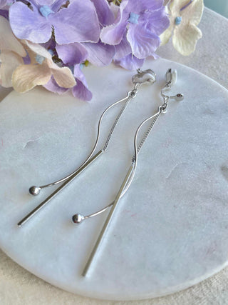 Setting the bar long clip-on earrings