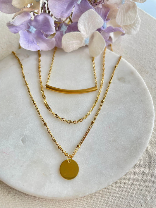 Three tiers of gold necklace