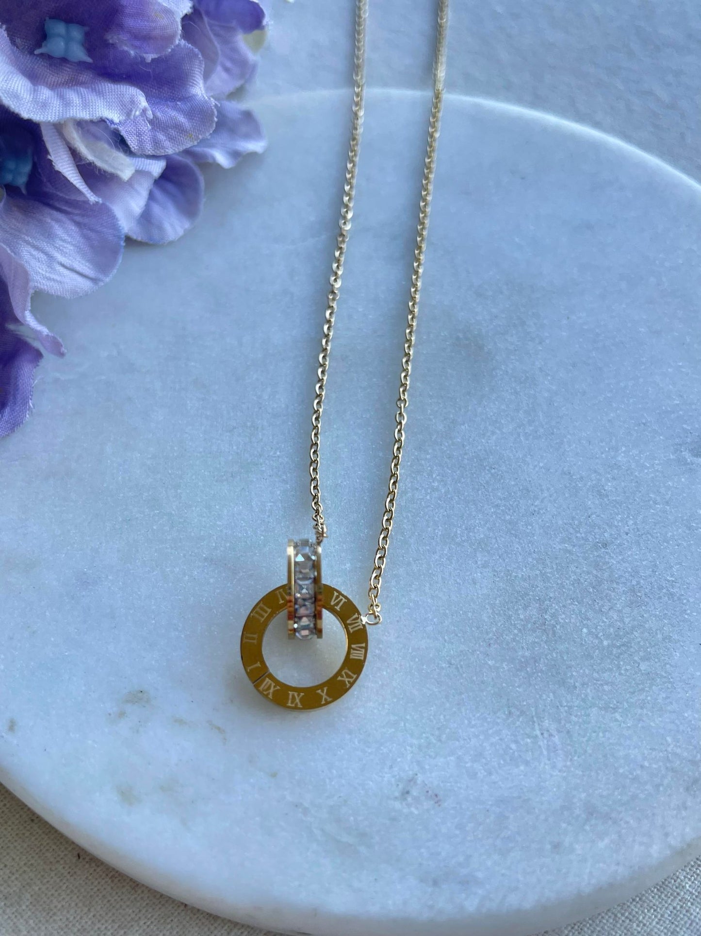 Rings on time gold necklace