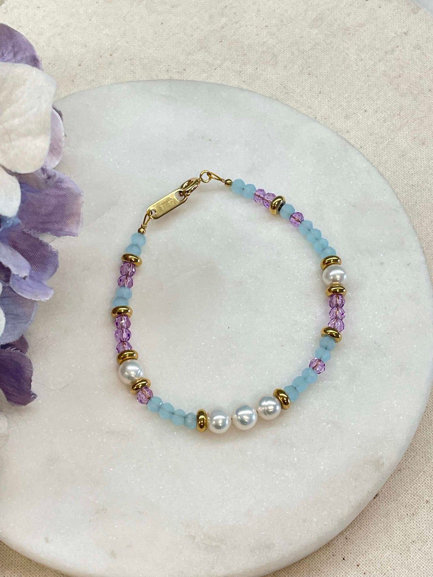 Pearl, purple and blue bracelets