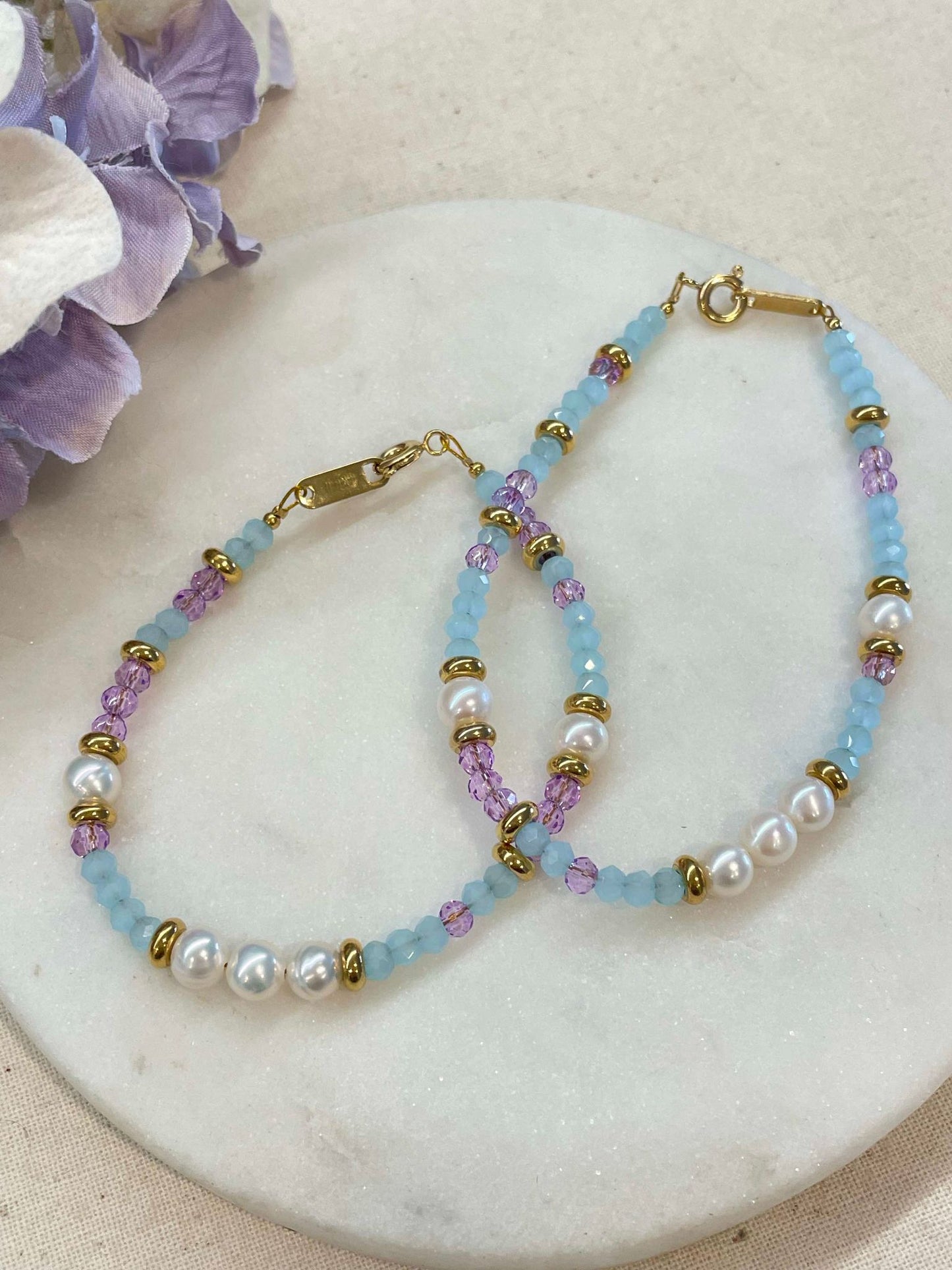 Pearl, purple and blue bracelets