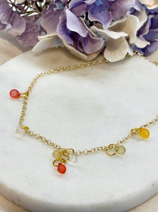 Droplets of glass on gold chain