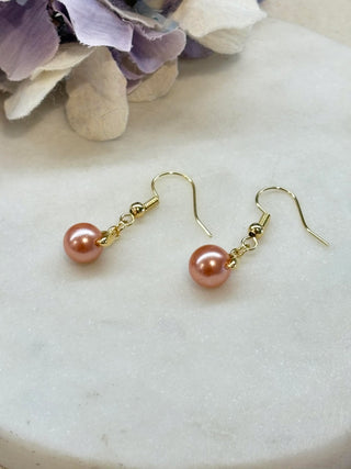 Caught a glass pearl - gold