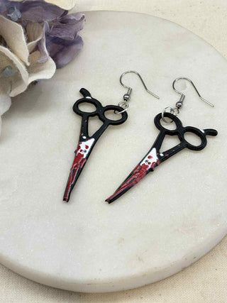 Cut to the bone earrings