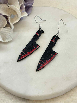 Cut to the bone earrings