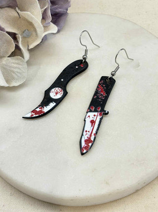 Cut to the bone earrings