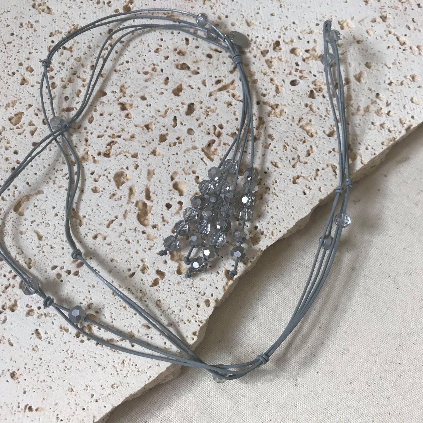 Grey leather with grey crystal necklace