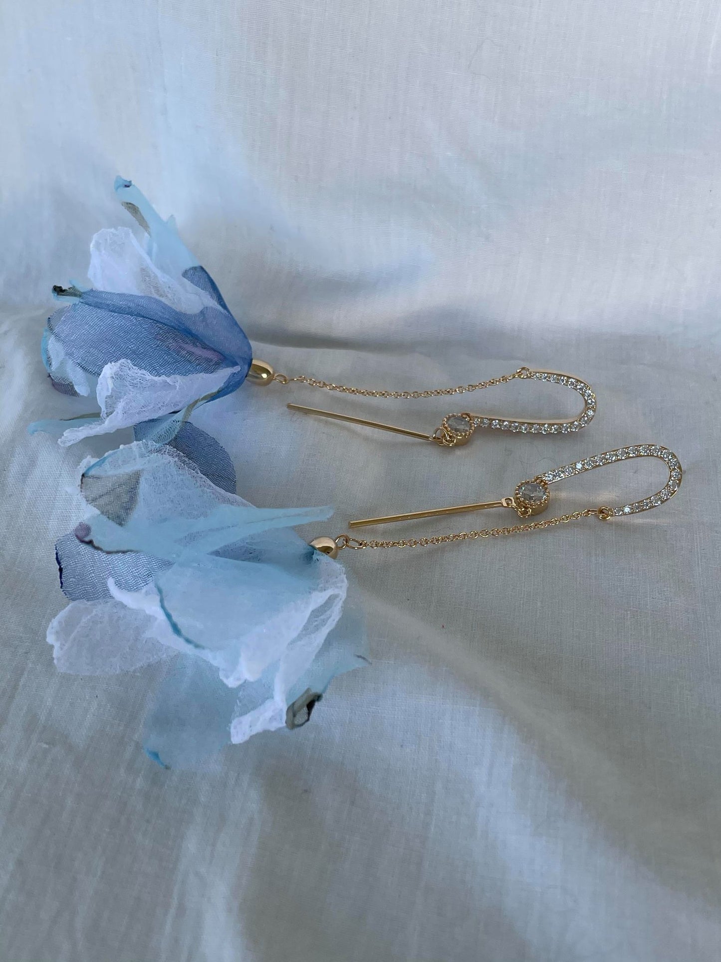 Fabric flowers on gold chain and crystal drop earrings