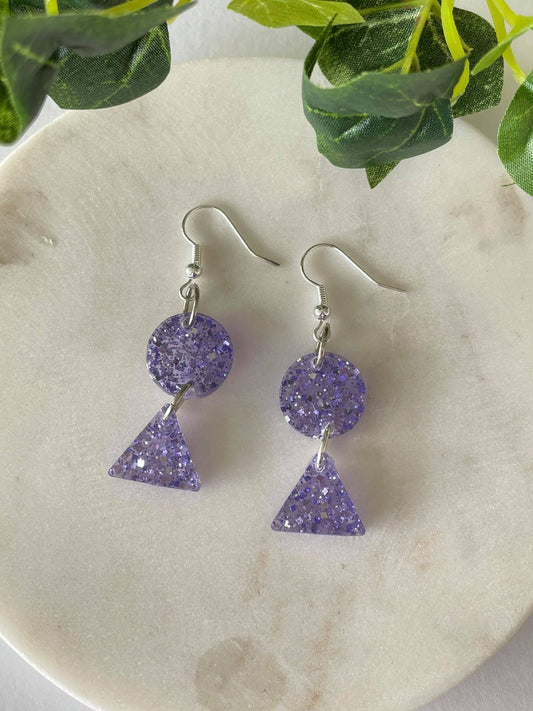 Light purple with silver glitter circles and triangles on hook earrings