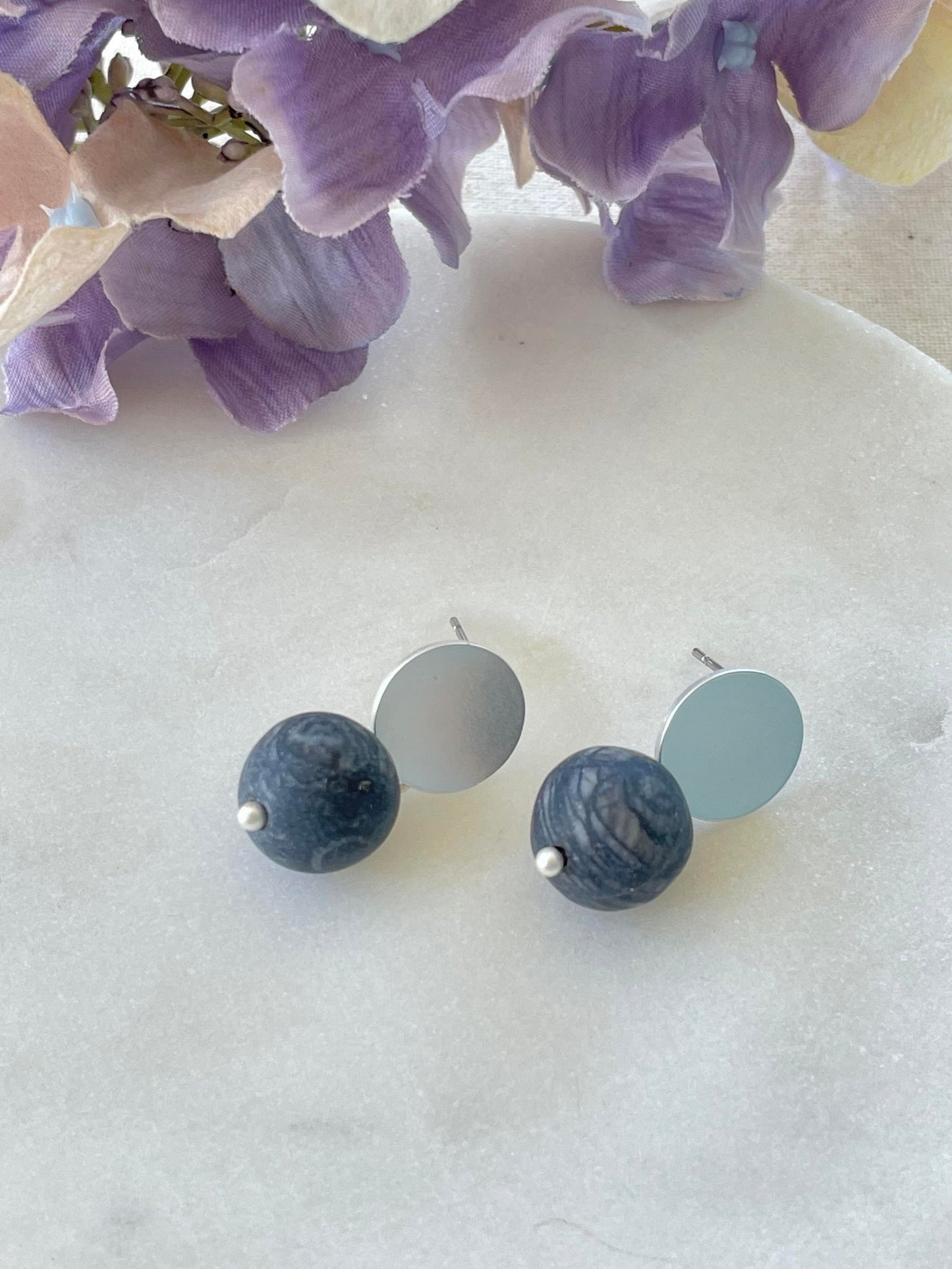 Small blackish bead on silver stud earrings
