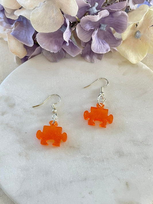 Orange jigsaw drop earrings
