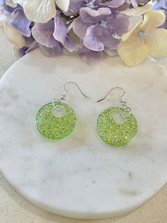 Off center lime green glitter donut earrings