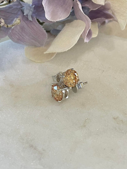 Light orange cubic zirconia sterling silver studs