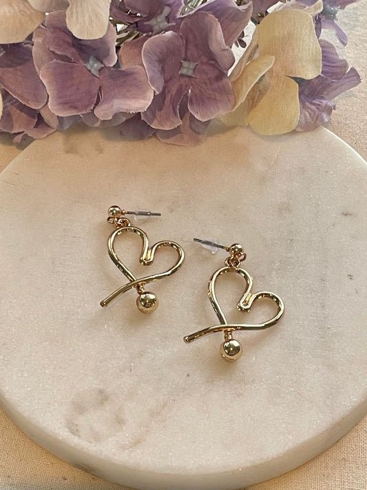 Loving heart gold stud earrings
