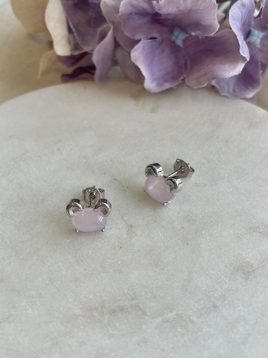 Sterling silver dog studs set with pink body