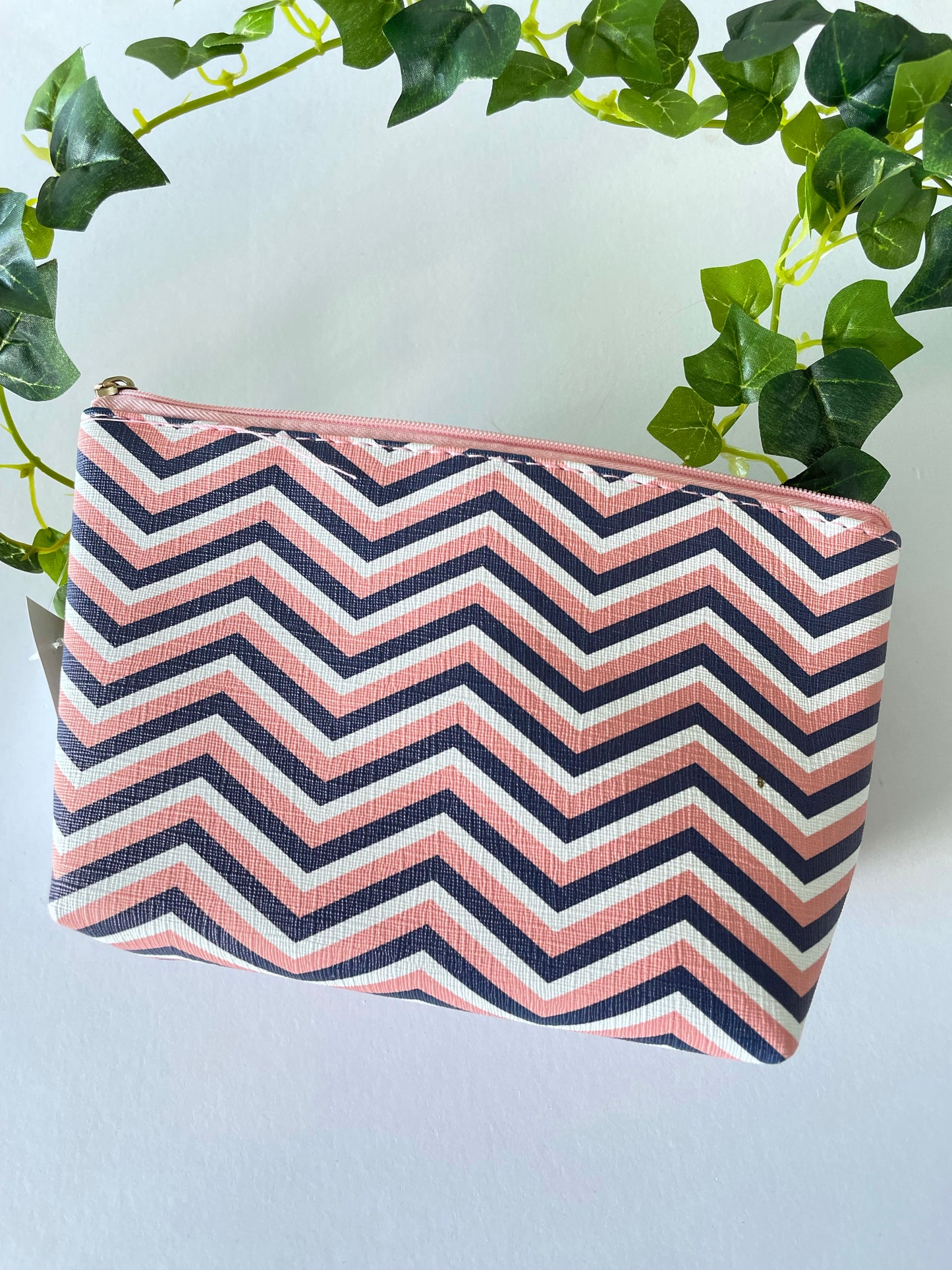 Pink and blue striped toiletry bag