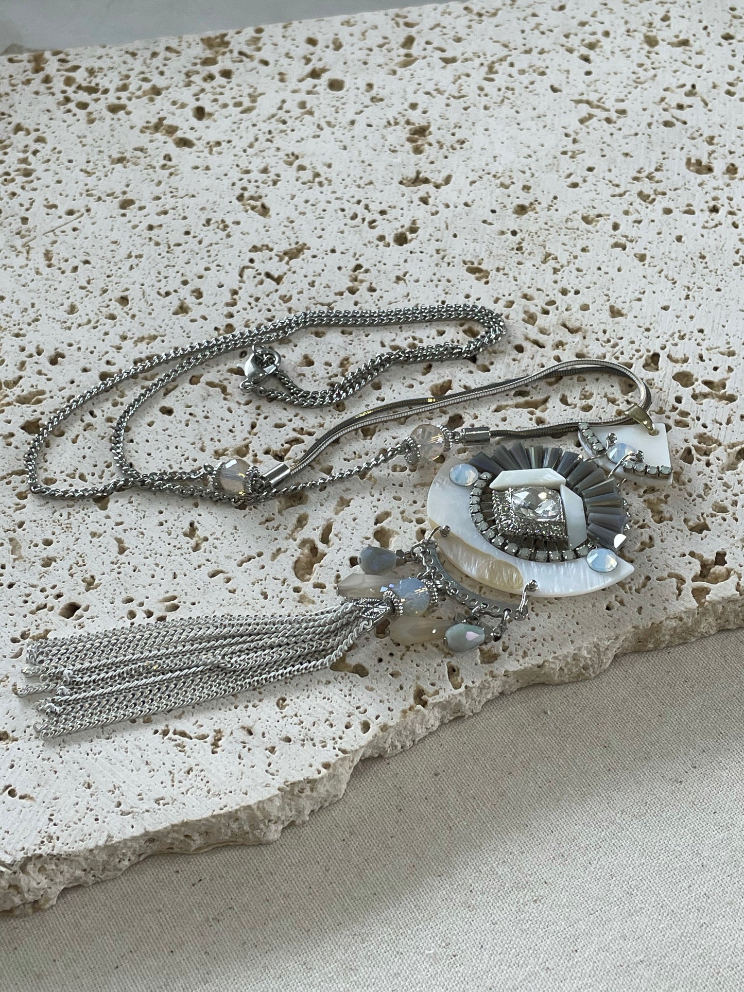 Multiple grey chains with stunning pendant