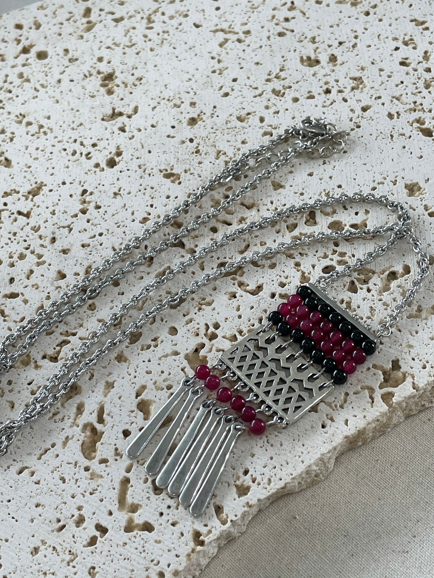 Red and black beads pendant on long silver necklace