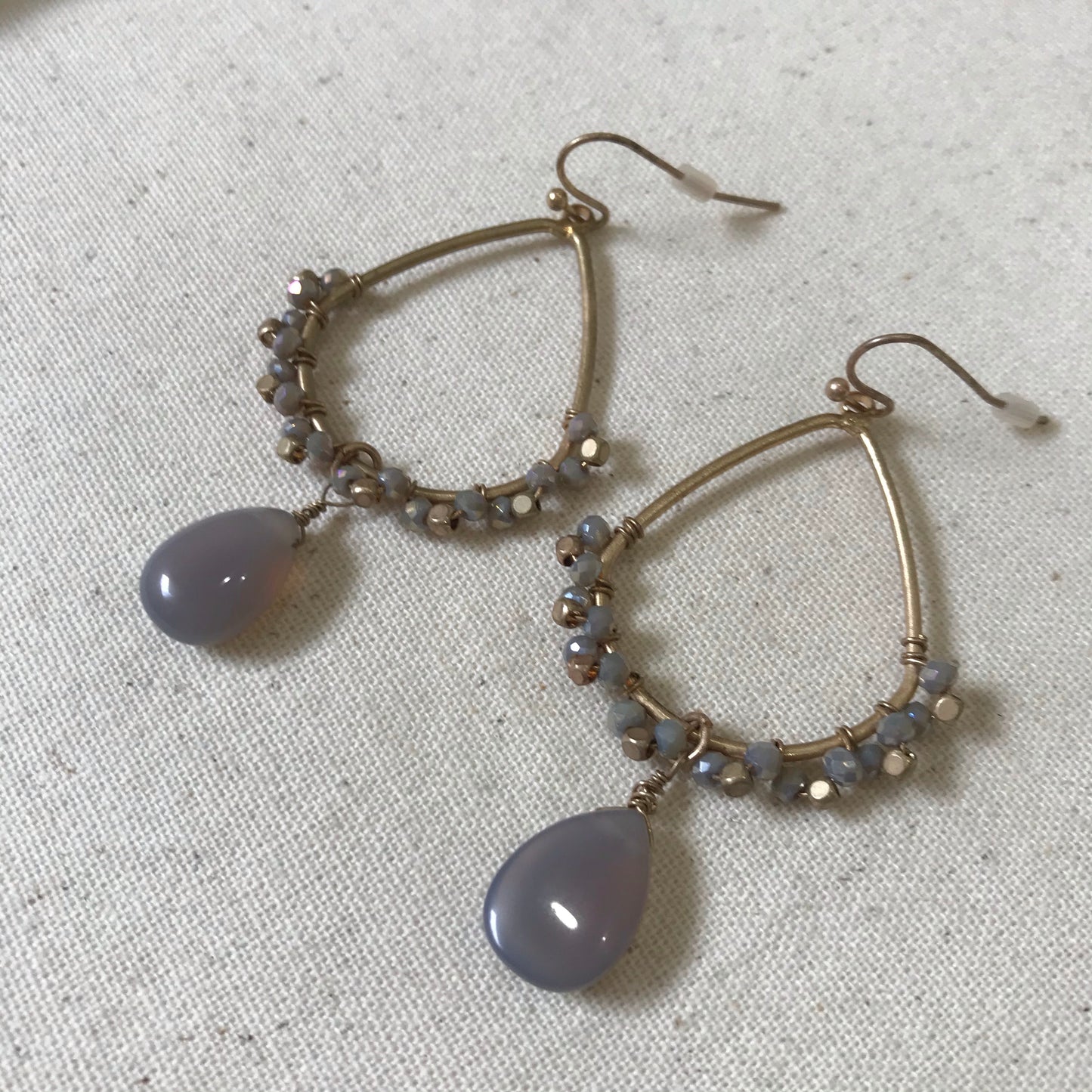 Gold tear drop earrings with grey beads